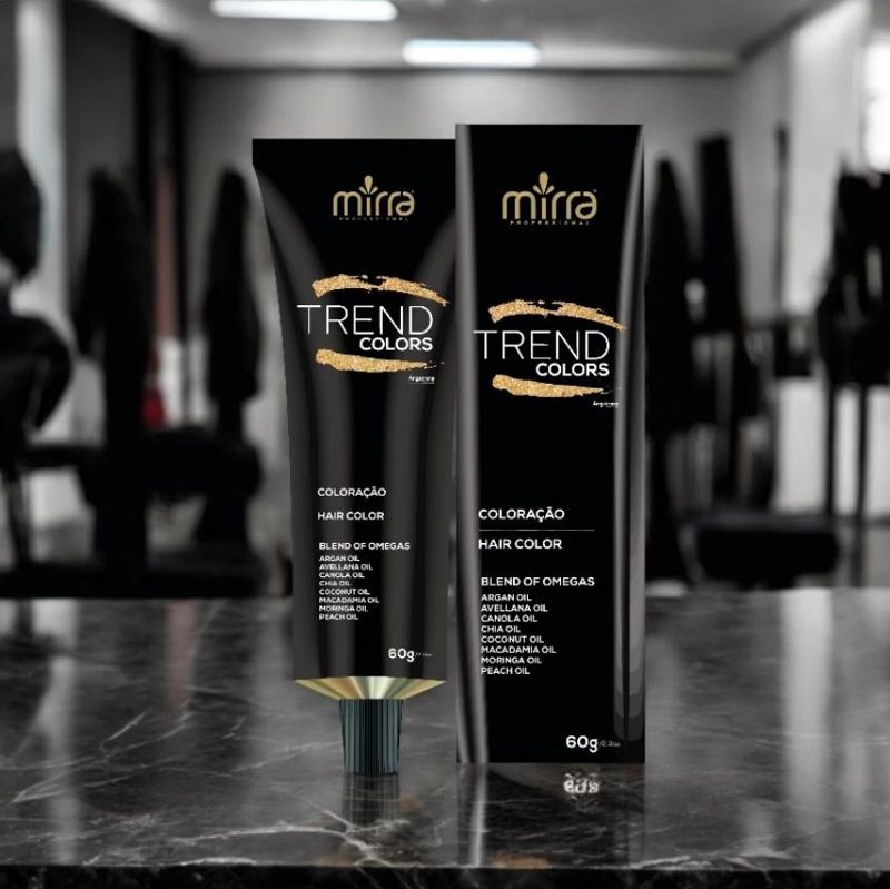 Coloração Mirra Trend Colors: bisnaga e caixa pretas e douradas sobre bancada de mármore em salão